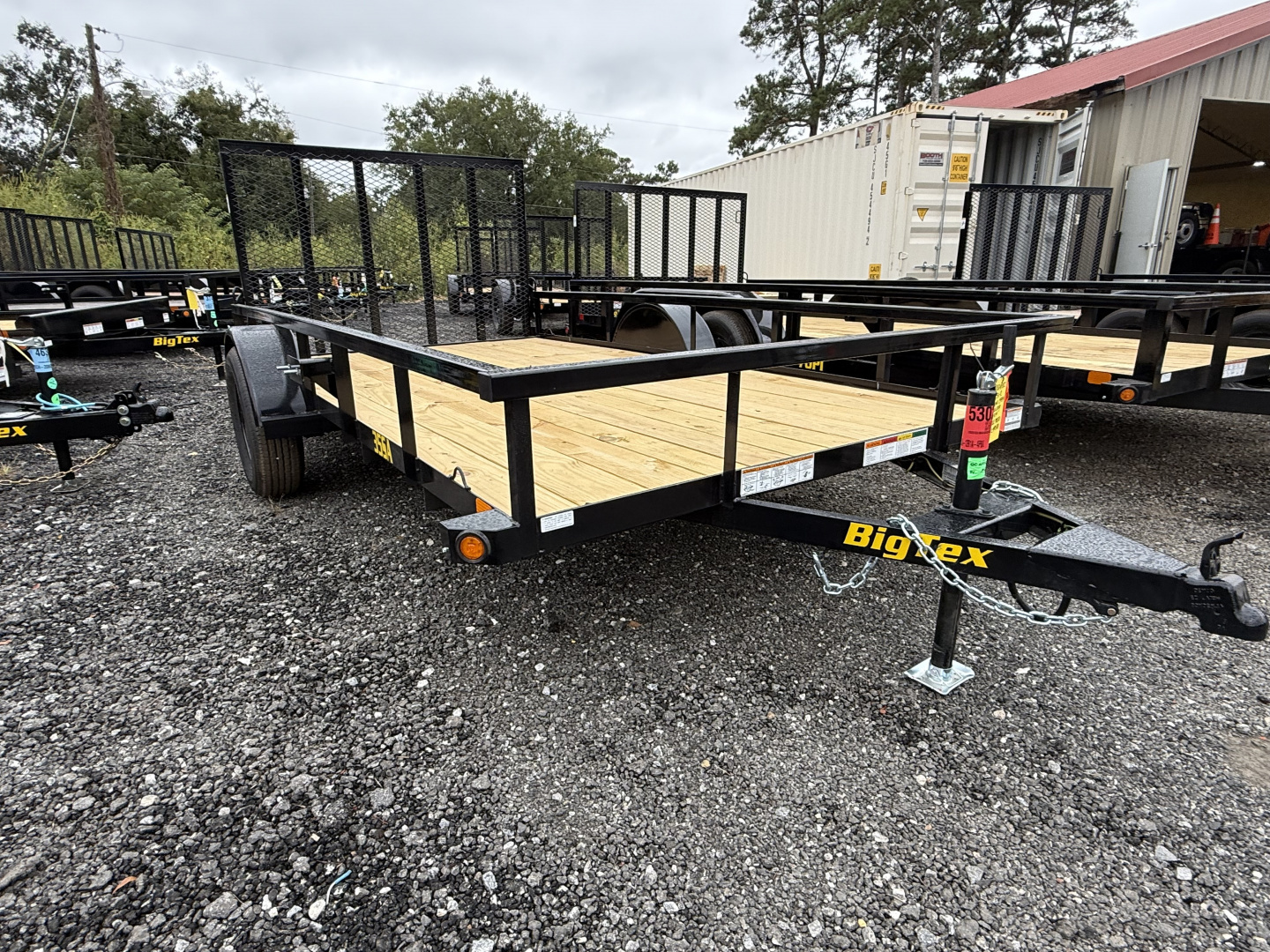 Big Tex utility trailer with pipe top rail