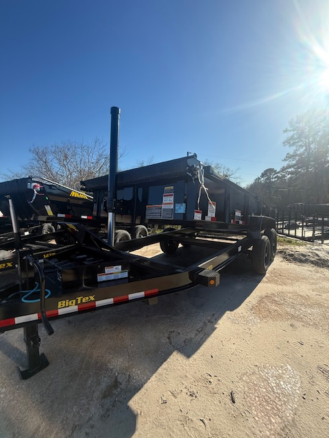 Big Tex dump trailer parked on a gravel lot with tailgate down